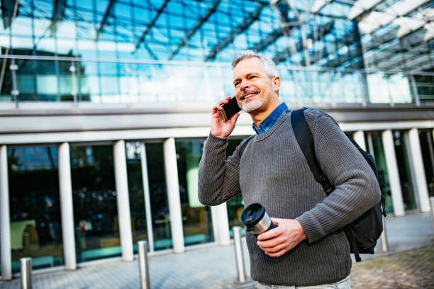istock Mature businessman commuting and using smart phone 1367335725