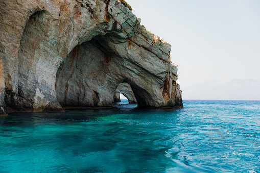 View of the turquoise Ionian Sea inside the beautiful hidden cave in Greece