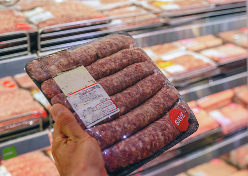 Packaged red meat sausage for sale in a grocery store