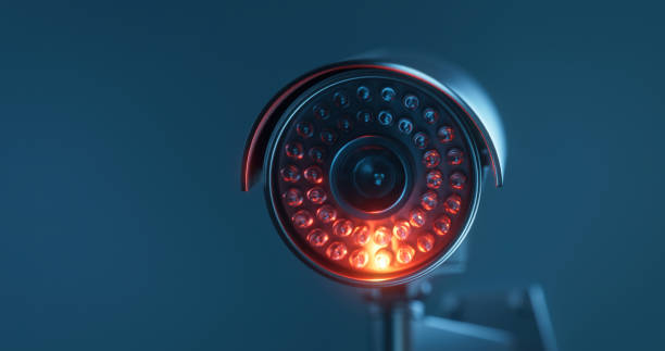istock CCTV camera with infrared light on a dark blue background with a copy space 1367340664