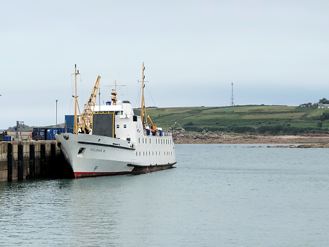 St Mary's harbour, St Mary's Island, Isles of Scilly. The Penzance to St Mary's Island ferry moored against the pier.