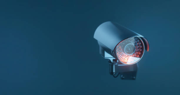 istock Security camera with infrared light on a dark blue background with a copy space 1367341644