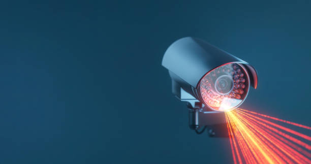 istock CCTV camera with infrared rays on a blue background with a copy space in close up 1367341648