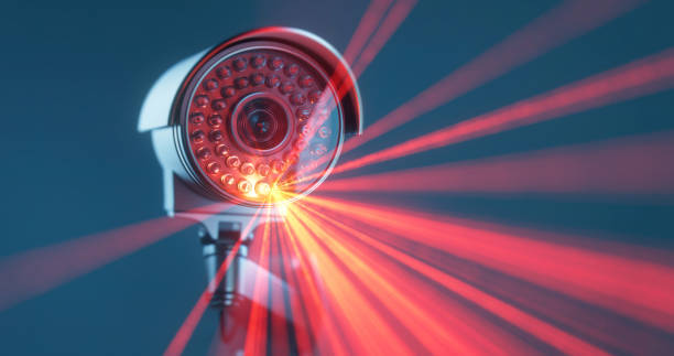 istock Infrared rays from security camera in close -up in a mate blue background 1367341669
