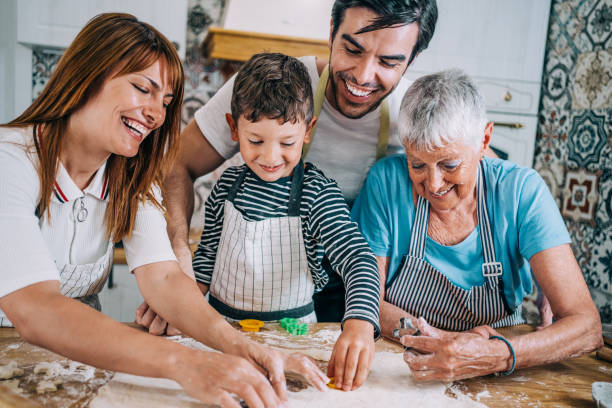 istock Multi-generation family having fun in the kitchen. 1367342102