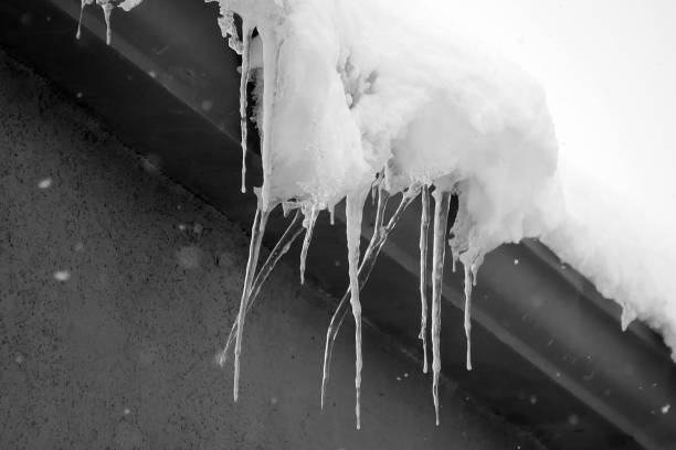 istock icicles on the roof, it's snowing, it's a hard winter, 1367342270