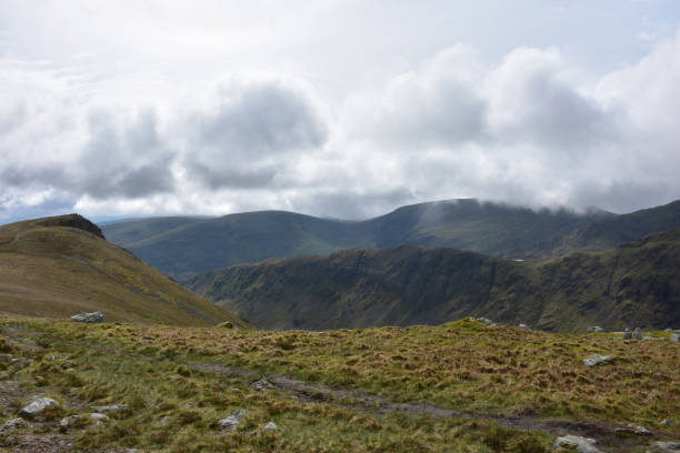 istock Clouds Hovering Over the Mountain Tops in England 1367342322