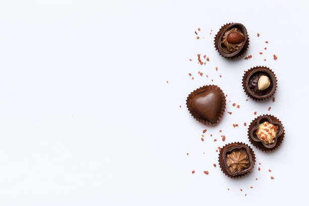 istock Different kinds of chocolates on colored table close-up. Top View and Flat Lay with copy space 1367343988