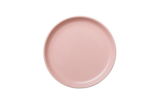 Pink ceramic round plate isolated over white background. Top view.