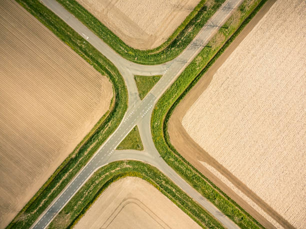 Crossroads in a rural landscape in the Noordoospolder in Flevoland, The Netherlands seen from above during a beautiful springtime day. The Noordoostpolder is a polder in the former Zuiderzee designed initially to create more