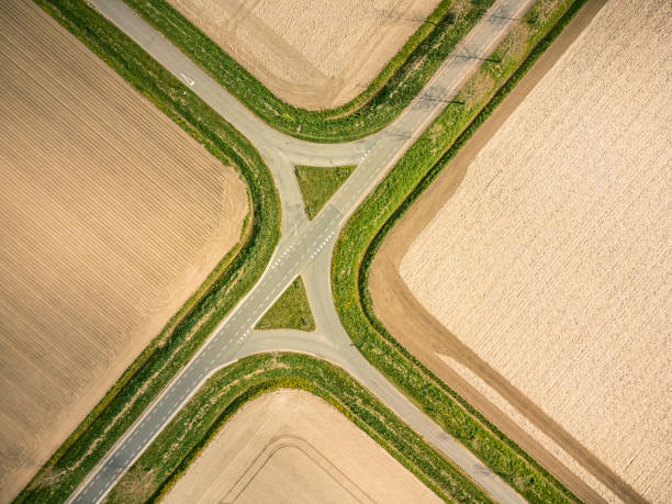 Crossroads in a rural landscape seen from above stock photo