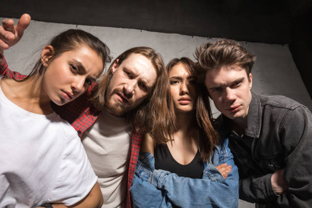 istock Angry hipsters friends standing over gray background 1367346301