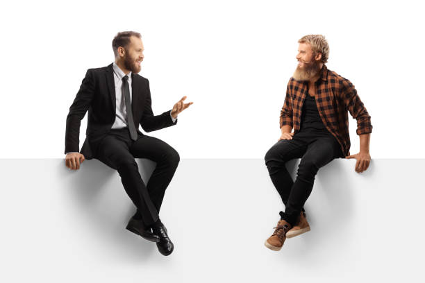 istock Casual man and a businessman having a conversation seated on a panel 1367346446