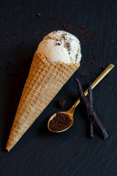 istock vanilla ice cream in cone, beans and spoon 1367347985