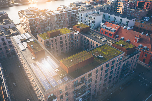 Solar panels on rooftops support sustainable lifestyle in the upscale Nordhavn in the smart city, Copenhagen