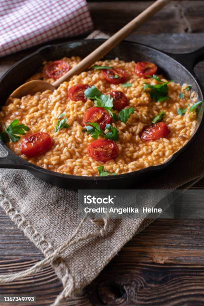 Traditional Risotto With Parmesan Cheese And Tomatoes Stock Photo - Download Image Now
