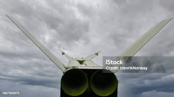 Missile On A Launch Pad Ready To Deploy In Time Of Conflict And War Gloomy Dark Clouds In The Background Stock Photo - Download Image Now