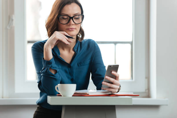 istock Woman at the cafe table 1367351119