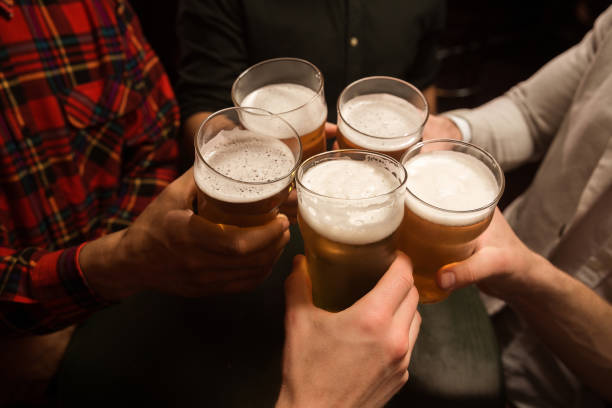 istock Close-up of men toasting with beer 1367351887