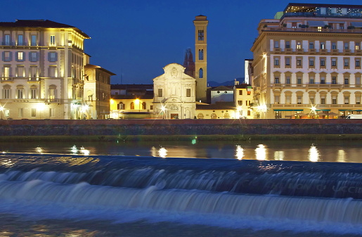Santa Rosa weir and Ognissanti square at night in Florence, Italy