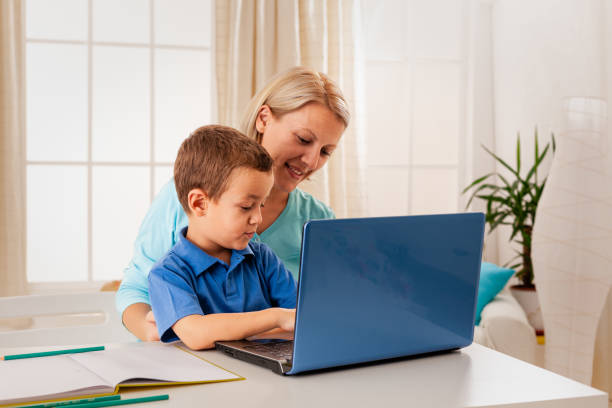 istock Mother and child with laptop 1367356724