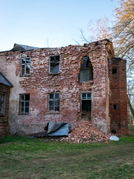 istock view of the old Augstroze manor, half-ruined side of red bricks, empty windows 1367358312