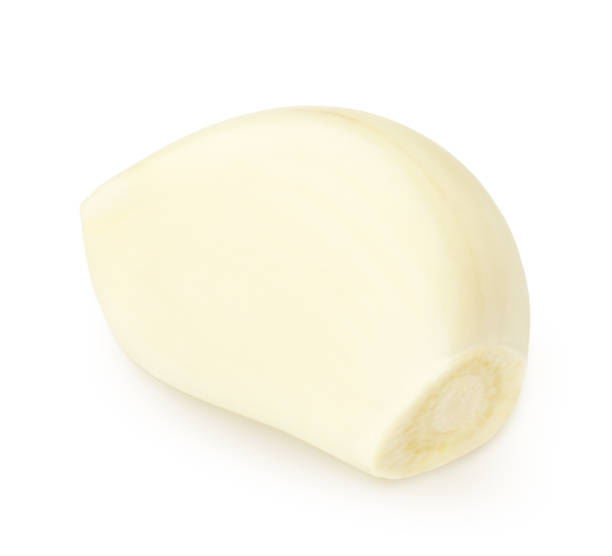 istock Fresh peeled garlic clove isolated on white background. 1367359615
