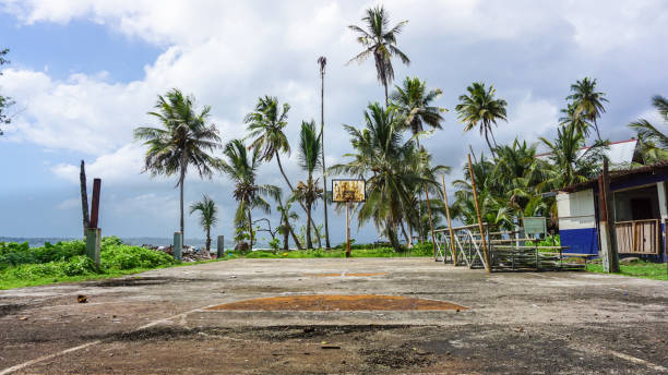 istock Abandoned basketball field with rust on the basket board. 1367359784