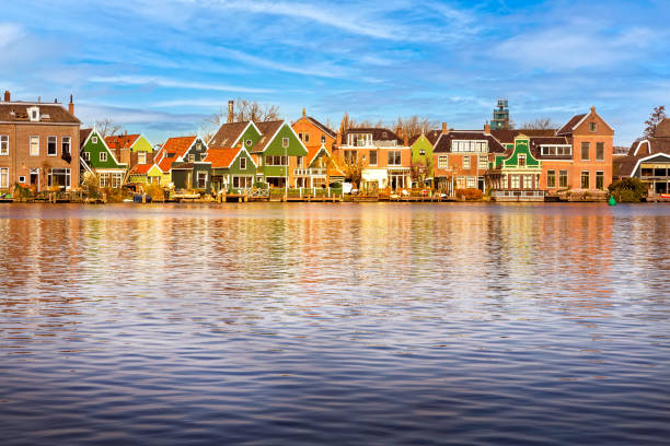 Dutch houses, Zaanse Schans in Netherlands Zaanse Schans, Netherlands panorama with row of old dutch green traditional houses near water zaanse schans stock pictures, royalty-free photos & images