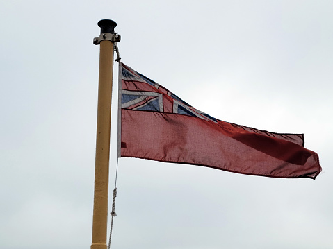 The red ensign flag flown on a ferry from Penzance to St Mary's Island in the Isles of Scilly.