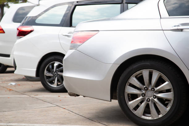 istock Car parking in line and car running background. 1367363676