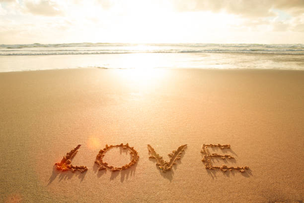 istock The word love written in the sand 1367364480