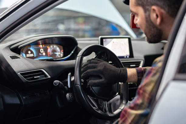 istock Happy mechanic examining car 1367366955