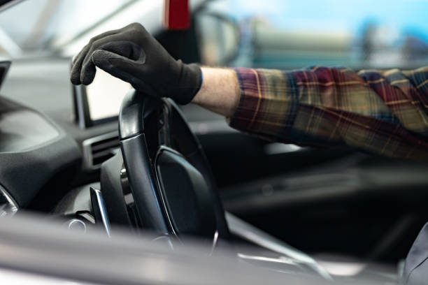 istock Happy mechanic examining car 1367367034