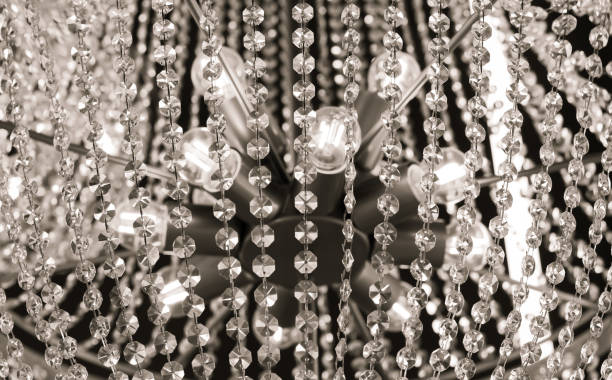 istock Luxury ceiling crystal chandelier in hotel close-up 1367369933