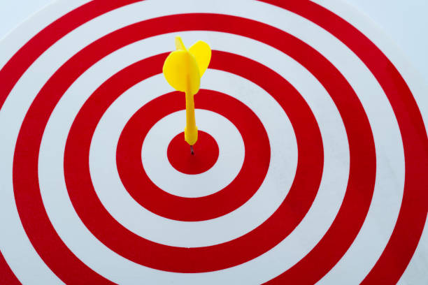 istock Dart arrow on center of dartboard 1367370773