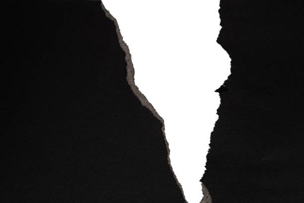 istock Background of torn black paper 1367370941