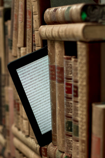 istock old books on the shelf with a tablet in between 1367372406