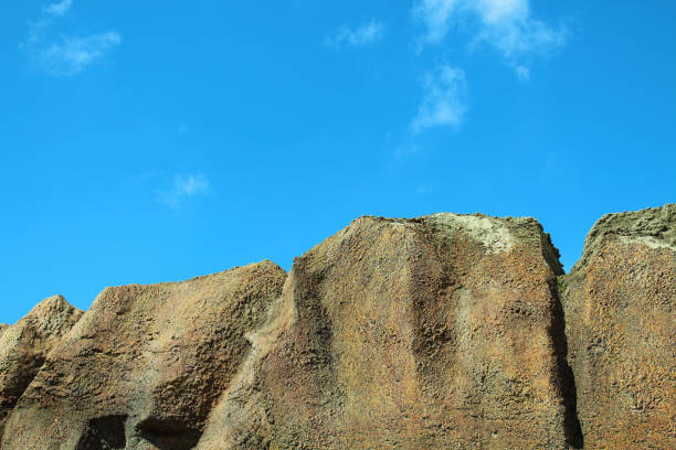 Beautiful decorative rock and blue sky. Close-up. Background.