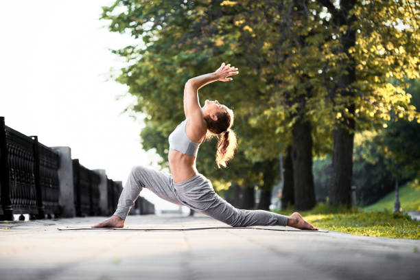 istock Yoga stretching exercises outdoor 1367373712
