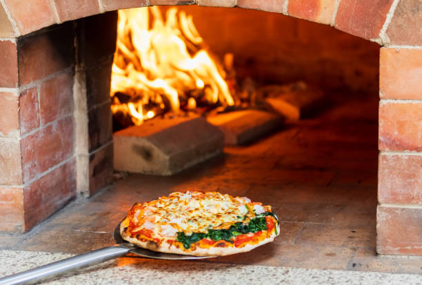 istock Italian pizza cooked in a wood-fired oven. 1367376258