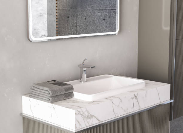 istock Close up of sink with square mirror standing in on grey wall, 1367376626