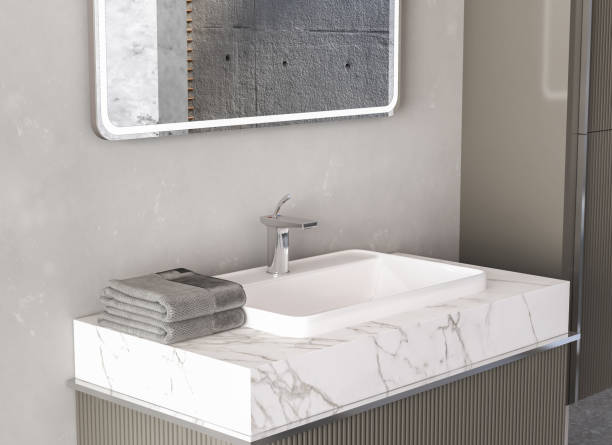Close up of sink with square mirror standing in on grey wall, stock photo