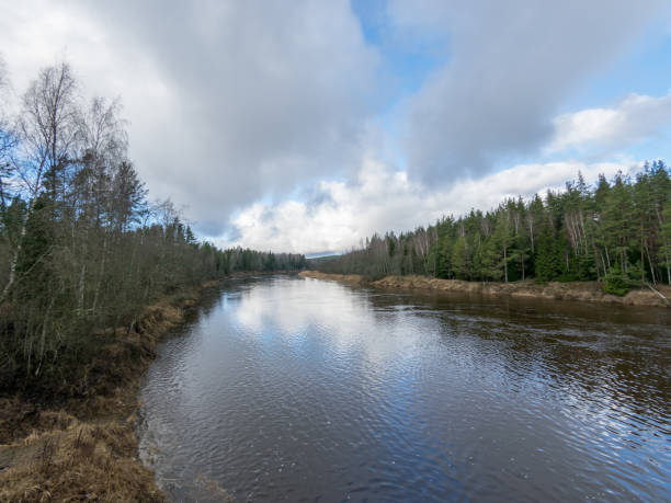 Landscape with river and clouds glare
