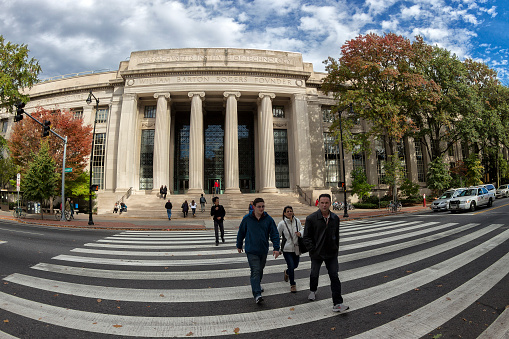Cambridge, MA, USA - October 10, 2017: view of the historic architecture of the famous Massachusetts Institute of Technology, MIT, in Cambridge, Massachusetts, USA showcasing its main building with students passing by.