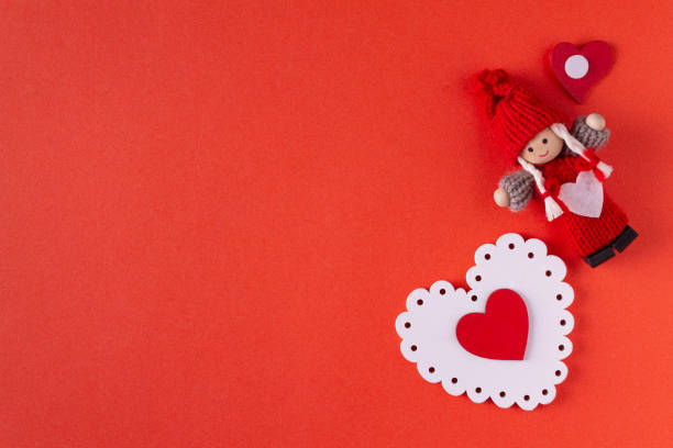 istock wooden heart on red background, copy space 1367380196