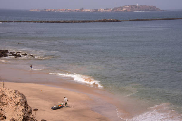 Dakar, Senegal - May 30, 2014: Beach on the coast and view of Goree Island on the horizon