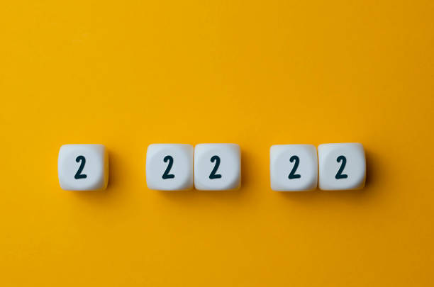 The unique date is February 22, 2022. Numbers 2 22 22 on white cubes shapes on yellow background. february stock pictures, royalty-free photos & images