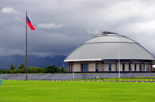 Apia, Samoa: Parliament of Samoa Legislative Assembly (Maota Fono) and Samoan flag - iconic building inspired in domed Fono houses of village councils - Guida Moseley Brown Architects (Australia) - Mulinu’u Peninsula.