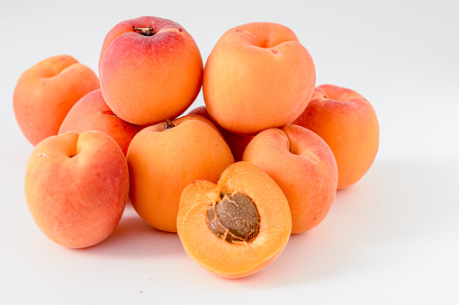 Three perishable Peaches with black background. India Summer season. Stone- fruit genus prunus family Rosaceae. Full of nutrition and delicious fruit. Not fresh wrinkled peaches. Inedible fruits.